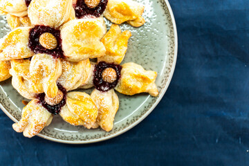 Puff pastry flower with raspberry jam filling. Baked goods. Desserts. Food concept.
