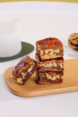 Xinjiang Jujube Date Nut Bars on Wooden Board - Traditional Chinese Sweet Treats with Dates and Nuts