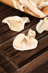 Dried White Jade Mushrooms from Changbai Mountain Northeast China on Wooden Board