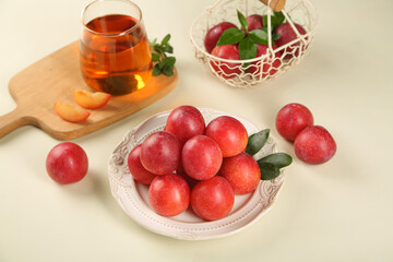 Fresh Red Plums on Plate with Tea Glass - Australian Imported Jumbo Stone Fruit Display