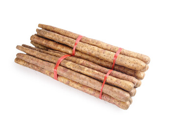 Fresh Yam Root Vegetable Sticks Bundled with Red Bands on White Background