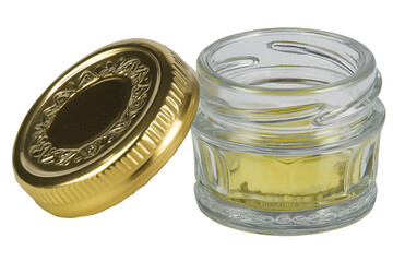 Small Clear Glass Jar with Golden Lid Containing Yellow Substance. Mock up promotion information for marketing announcements and details, blank white space.