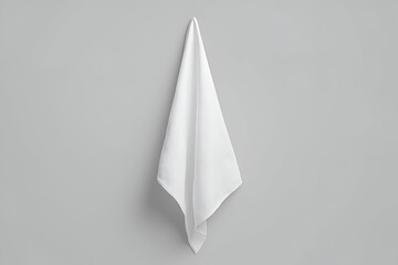 Clean White Towel Hanging Against Gray Wall Background. Mock up promotion information for marketing announcements and details, blank white space.