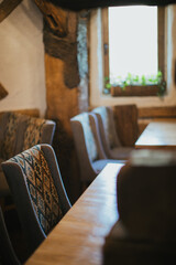Empty cafe chairs and tables with window light