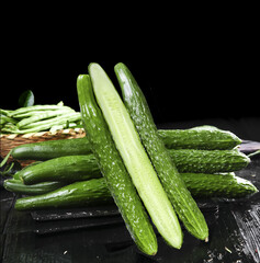 Fresh Farm Grown Cucumbers with Prickly Crunchy Flavor on Rustic Wood Background