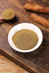 Ground Cumin Powder Spice with Cinnamon Sticks on Wooden Board - BBQ Cooking Essentials