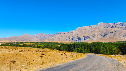 The scenery while traveling on rural road to Demirkazik Village on a sunny day.