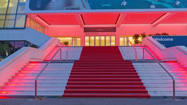 Welcome Sign Red Carpet Festival Building in Cannes France at Night