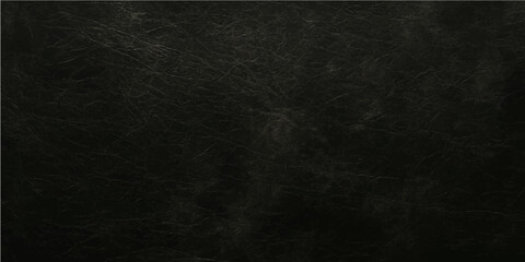 An old, dark black chalkboard with a textured grunge surface provides a blank backdrop for vintage design