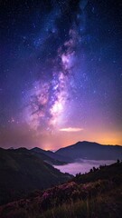 Milky Way above misty mountains