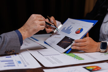Business team discussing project in late night in the office meeting.
