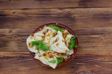 Delicious homemade dumplings on a wooden table