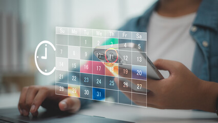 Digital calendar scheduling concept with person holding smartphone, marking important date. Ideal...