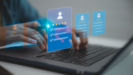 Business hand selecting digital rating card on laptop screen. Concept of user review, performance...