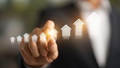 A hand points to a rising graph of homes, signifying growth