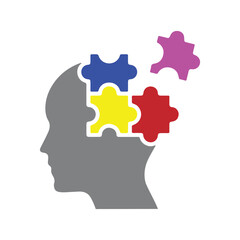 Puzzle Pieces Fitting Into Silhouette of Human Head