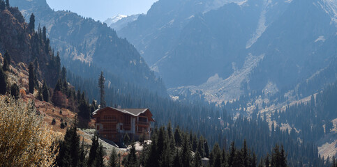 A house in the mountains, a landscape with a secluded house on the mountainside, a vacation in a villa in the mountains