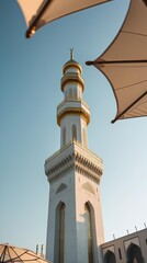 a majestic view of the minaret of a mosque, captured from below