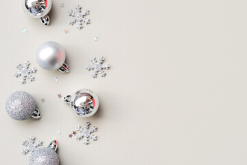Christmas composition. Christmas tree glittering balls on a monochrome background. View from above.