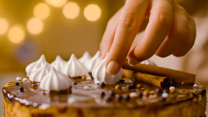 Close-up: Hand Decorating Decadent Chocolate Meringue Cake