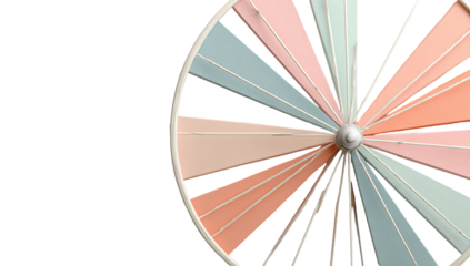 Close-up of a decorative windmill.  Pastel-colored, triangular blades radiate from a white hub.  Against black background