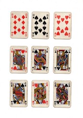 Three different hands of grubby vintage playing cards isolated on a white background.