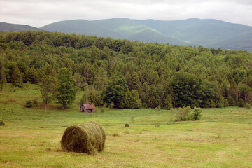 Hay bales and sugar house in the summer in Vermont