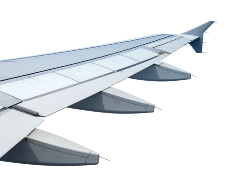 Close-up of a large airplane wing, showing detailed paneling, flaps, and ailerons against a black background