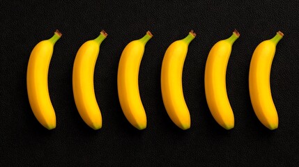 Six Yellow Bananas in a Row on Black Background