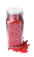 Red peppercorns in glass jar isolated on white. Aromatic spice