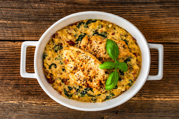 Creamy Tuscan chicken with parmesan cheese, spinach and sun dried tomatoes