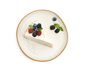 Piece of tasty crepe cake with berries and mint isolated on white, top view