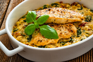 Creamy Tuscan chicken with parmesan cheese, spinach and sun dried tomatoes
