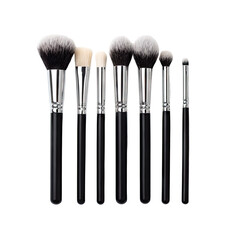 Seven makeup brushes with black handles and gray/white heads