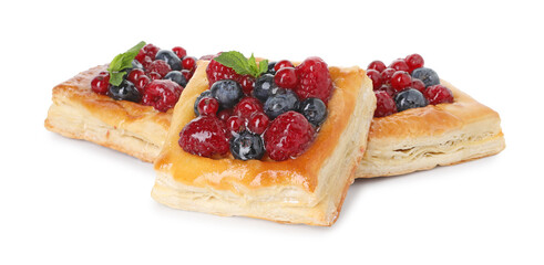 Tasty puff pastries with berries and mint isolated on white