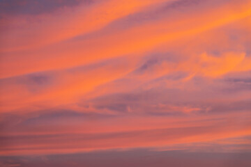 Beautiful sky with dramatic pink and purple clouds at sunset. Natural abstract background and atmospheric landscape