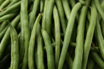 Fresh green bean pods as background, closeup