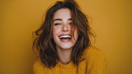 Joyful woman smiling brightly against yellow background portrait lifestyle cheerful environment close-up happiness concept
