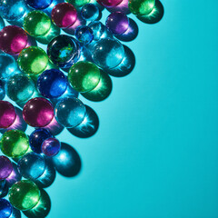 Neon glass orbs stacked along the left edge on bright teal. Clean hero layout with wide right copy space for web headers and social posts.