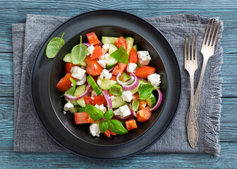 tomato cucumber salad with goat cheese, basil