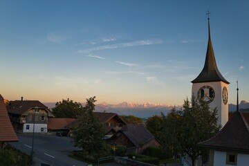 Rüeggisberg in the evening in Switzerland with Alpine panorama