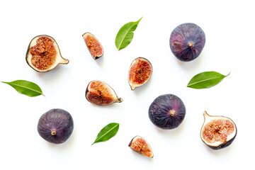 Purple ripe figs fruit and slices with green leaves top view on a white background