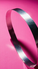 A shiny holographic ribbon cuts diagonally across hot pink, leaving a clean central copy zone. Perfect for banners, stories and ads.