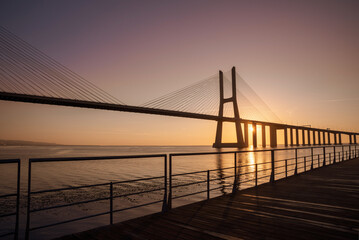 Sunrise Over Vasco da Gama Bridge Spanning the Tagus River in Lisbon, Portugal