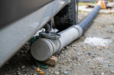  Camper van grey water drainage pipe system close up outdoors