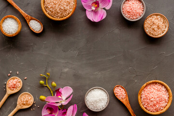 Spa treatment body care cosmetics - sea salt and scrubs in bowls, top view