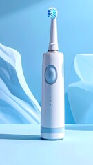 Modern electric toothbrush on a light blue background