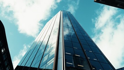 Corporate Skyscraper Touching The Blue Sky - Powered by Adobe