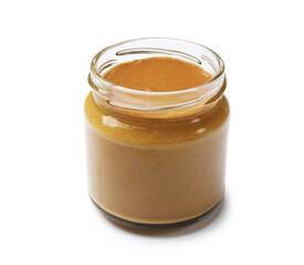 Tasty mustard sauce in glass jar isolated on white