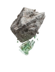 A grey, rough-hewn rock fragment hovers above smaller, translucent, green crystalline pieces against a black background
